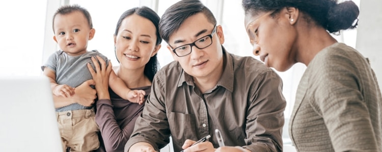 Parents of a toddler talk with a financial adviser about the advantages and disadvantages of a certificate of deposit (CD).