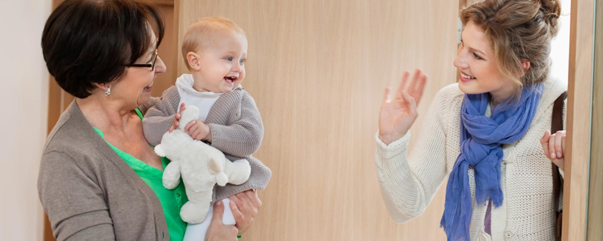 Two people, one holding a baby