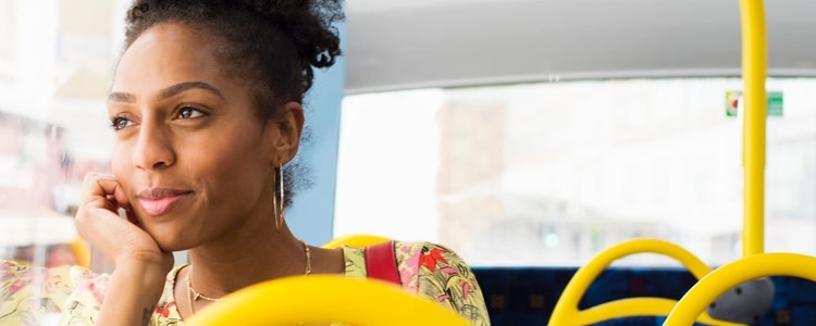 Woman daydreams about what to do with her growing savings