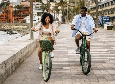 image of couple biking