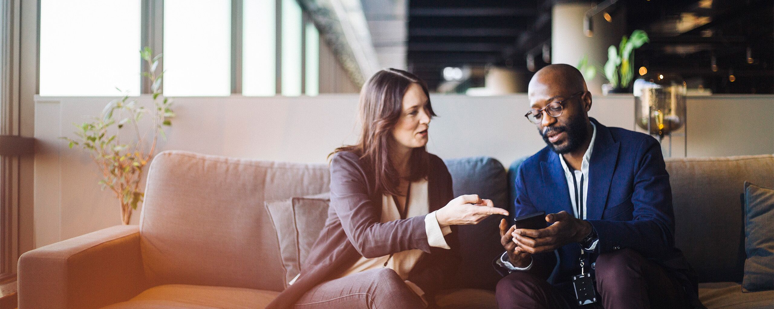 Two coworkers having a conversation.