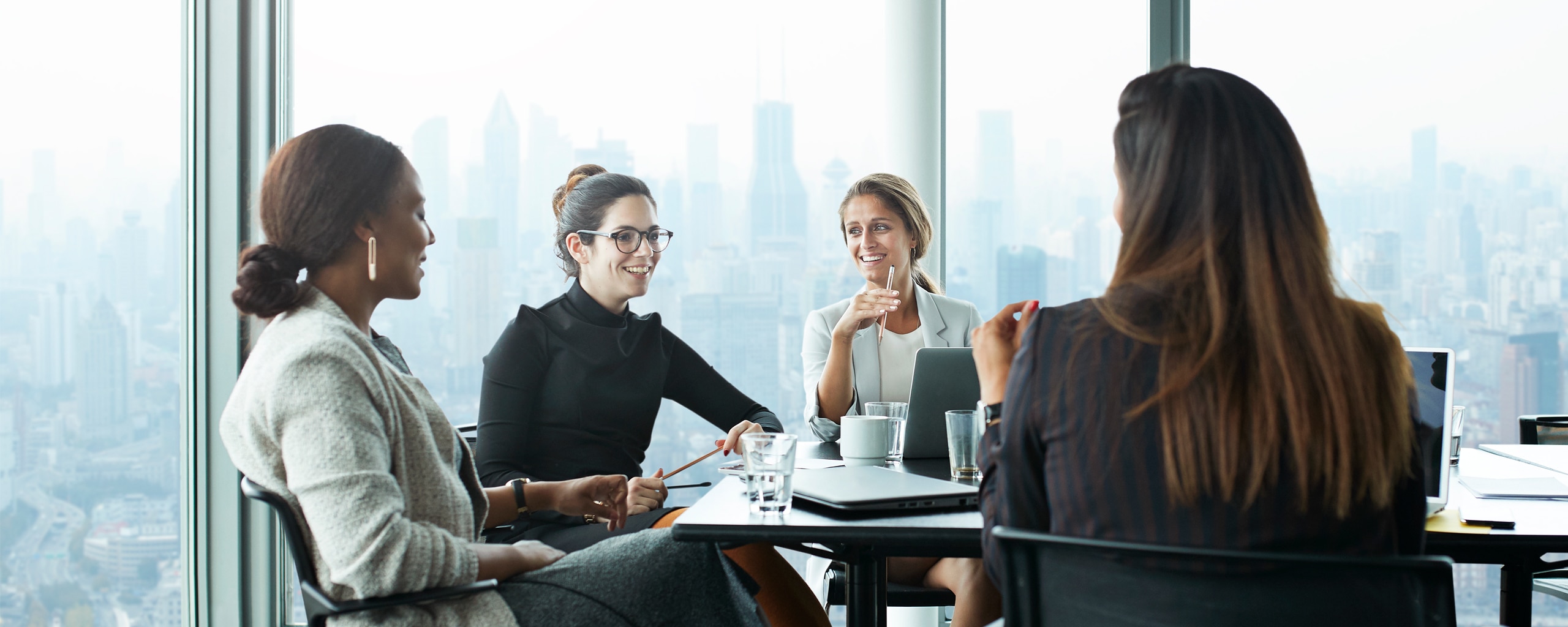 Women sitting at office table