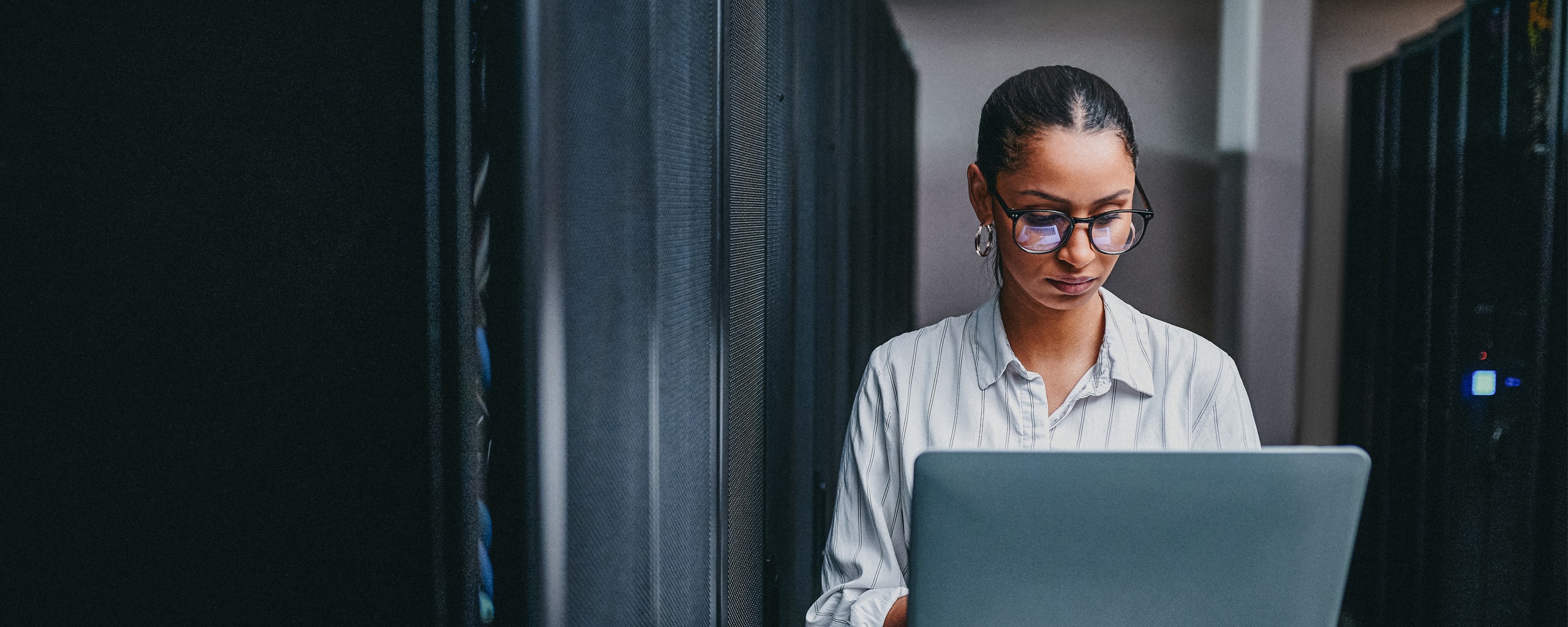 A woman works on her laptop