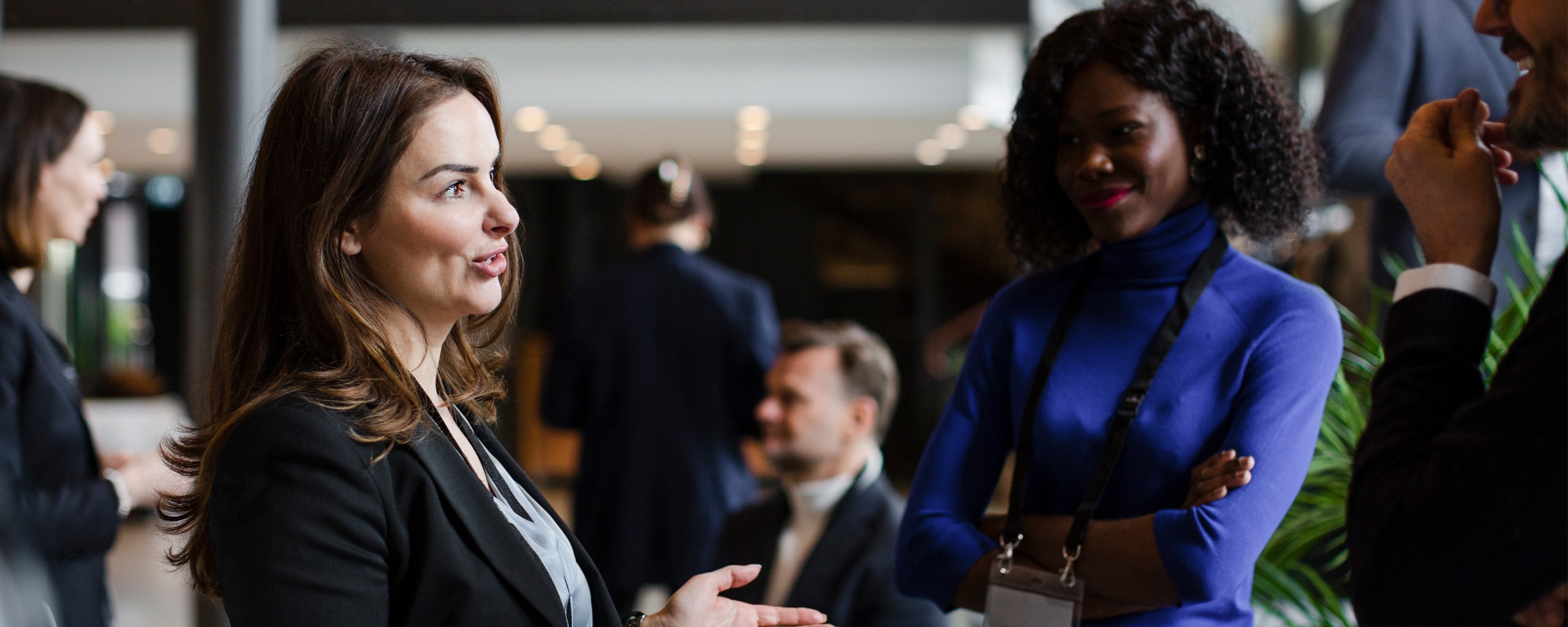 Individuals interacting at a professional conference.
