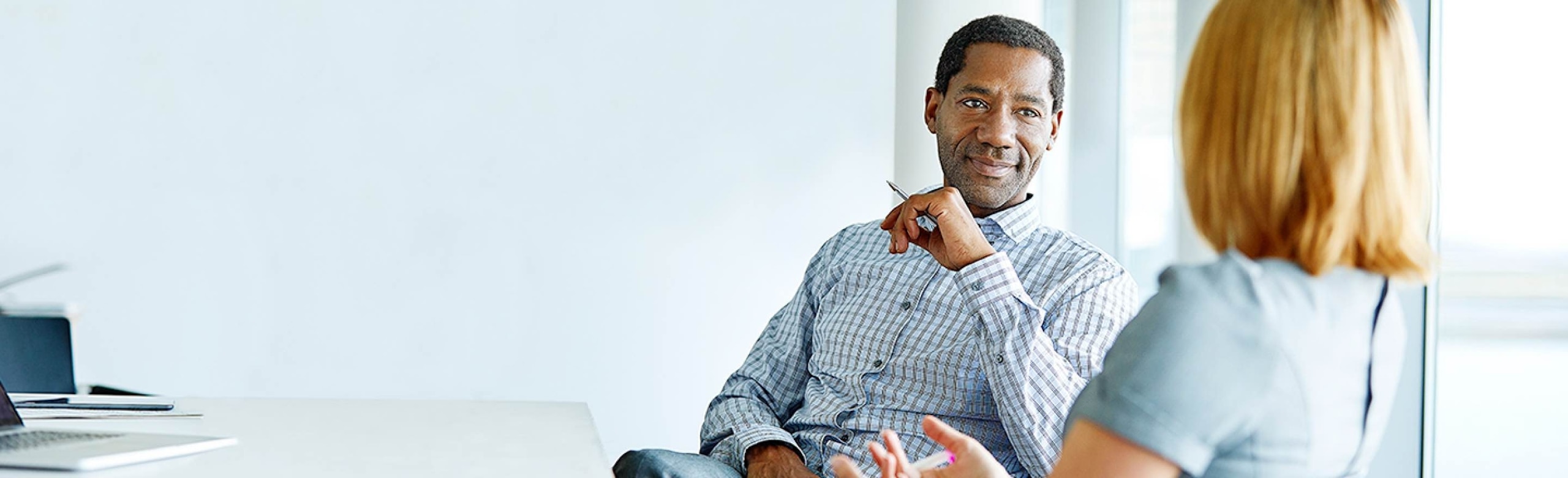 Two Commercial Banking colleagues sit together to discuss the LIBOR transition