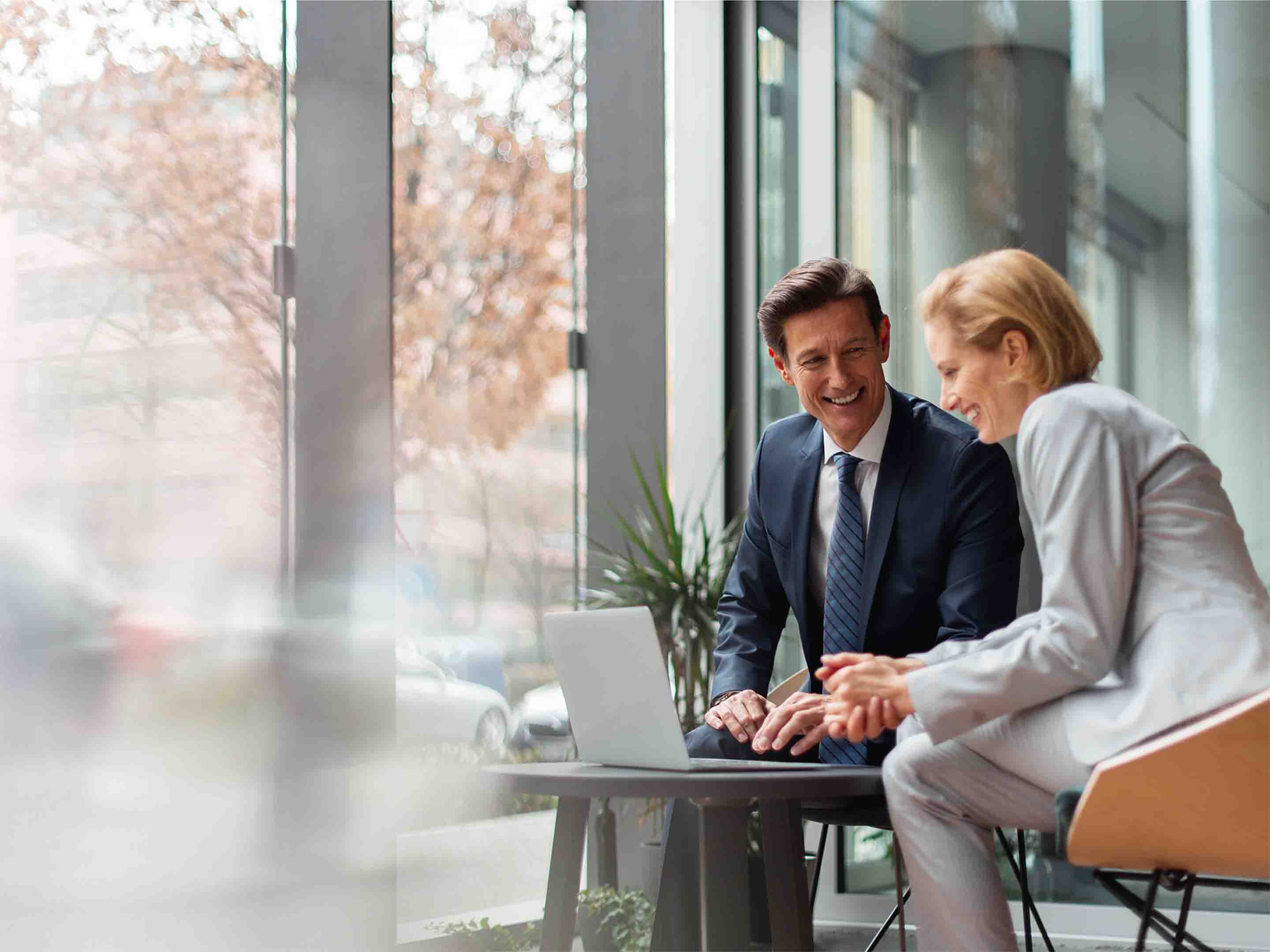 man and women in a conversation in a business setting
