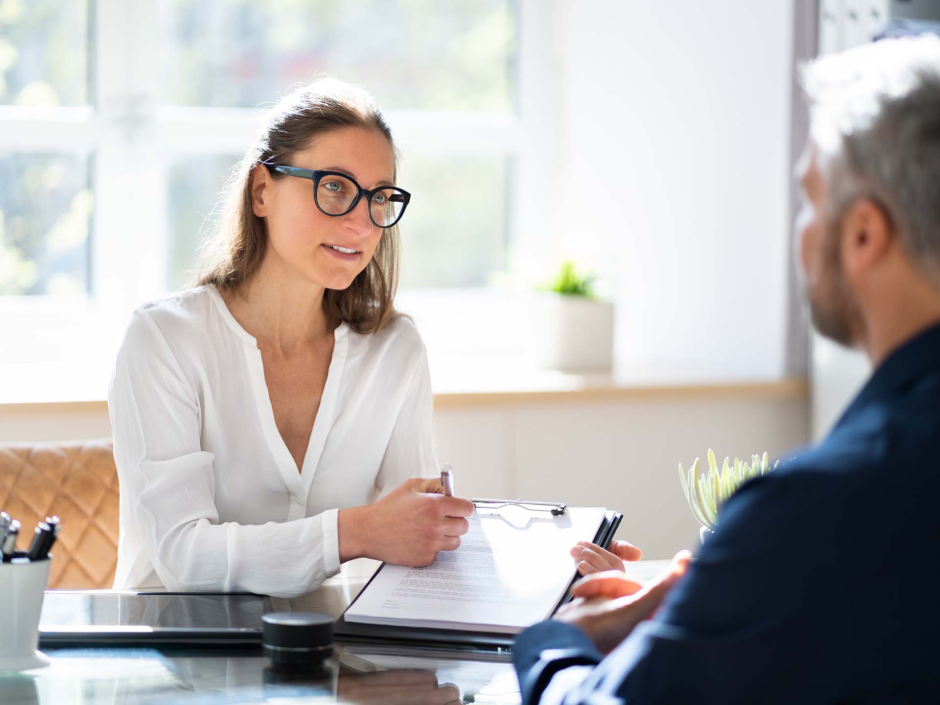 women in business attire conducting a meeting