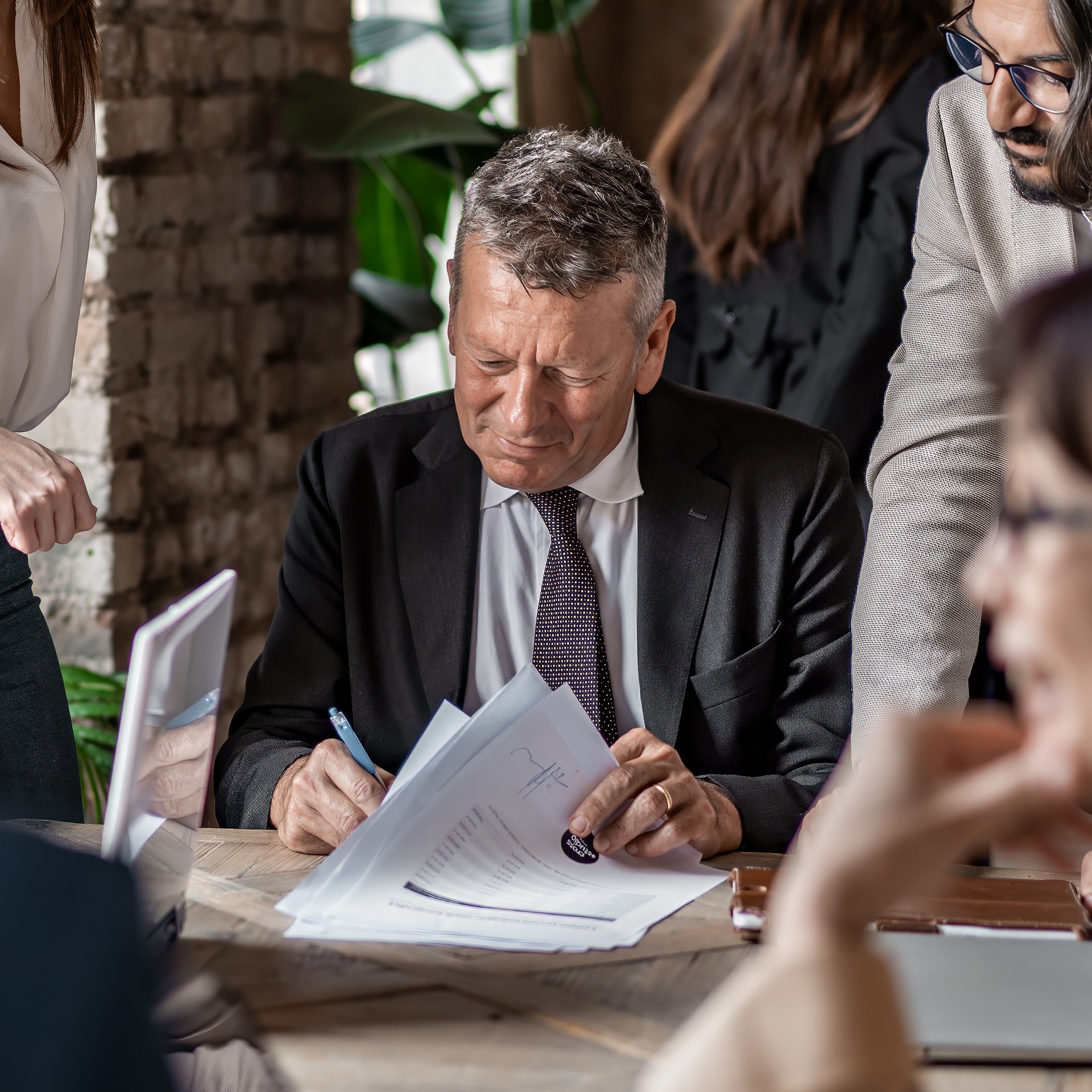 Man in business suit looking at documents