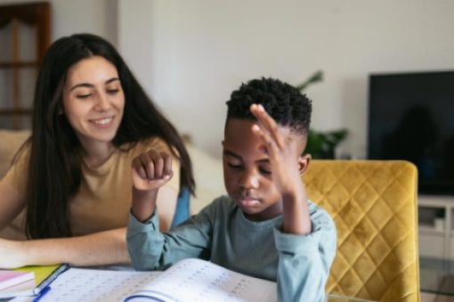 A college student tutors a younger student as a side hustle.