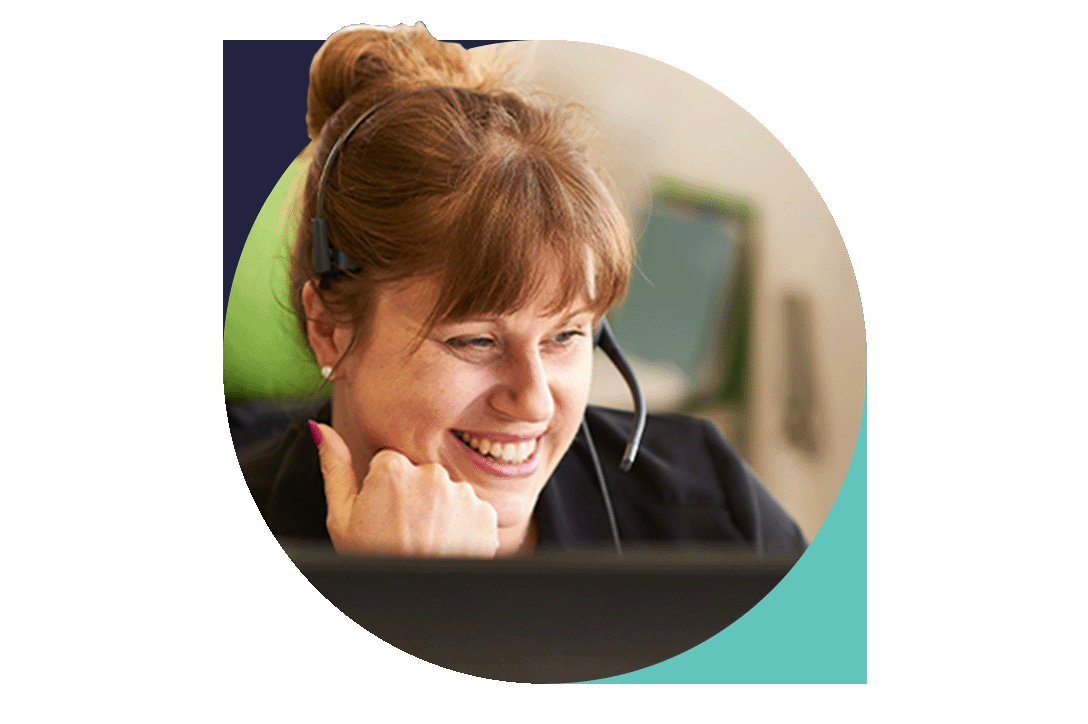 Female customer service agent with headset on talking on the phone