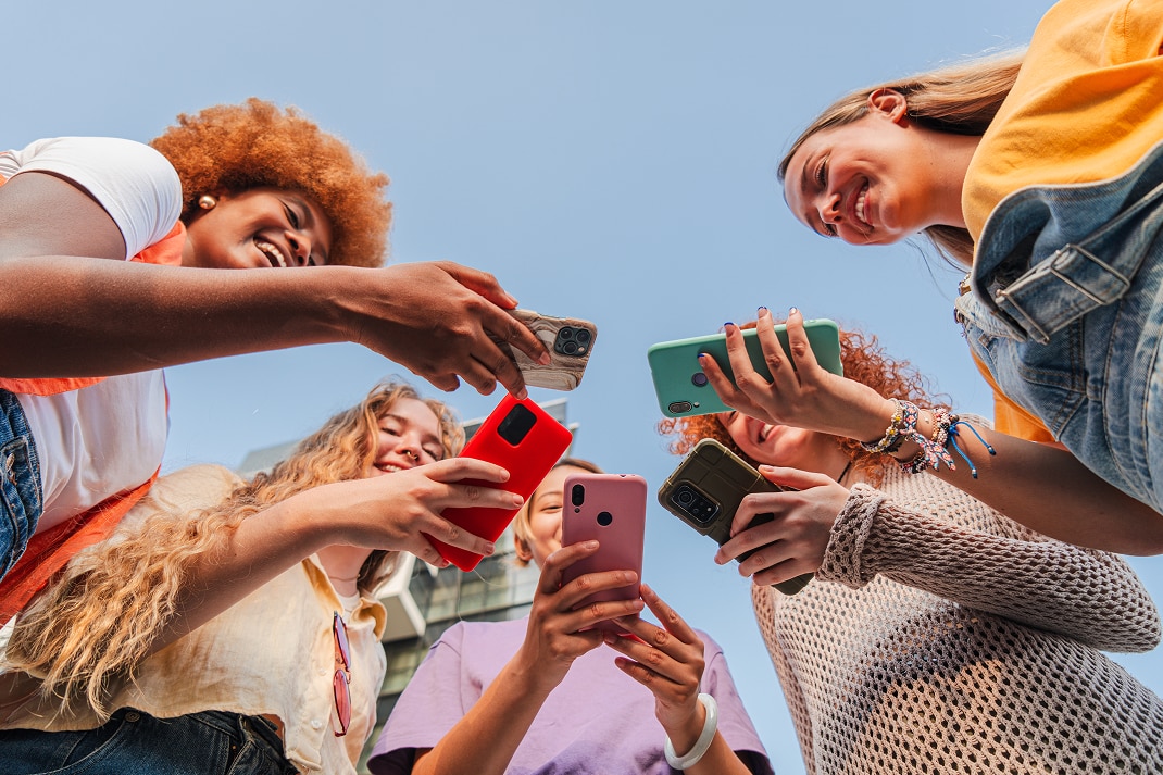 group looking at their phones