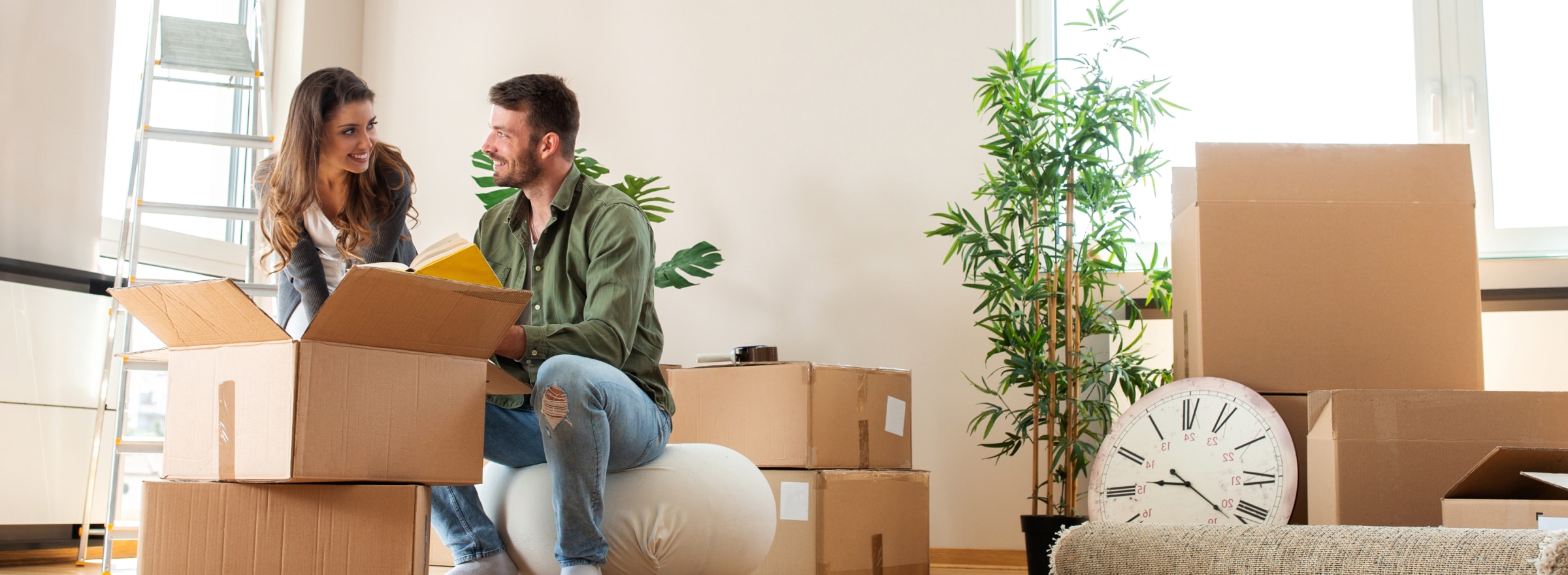 Two people packing boxes