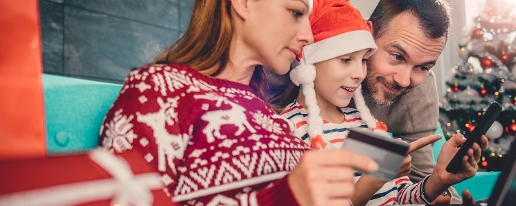 Family uses the Capital One Mobile App to redeem QuicksilverOne rewards.