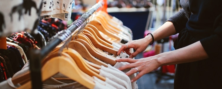 Woman shopping at clothing store.