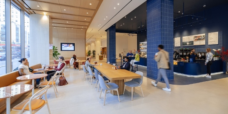 Community members relax, recharge and reconnect at their local Capital One Café.