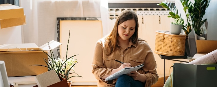 A person checking their list in preparation for moving.