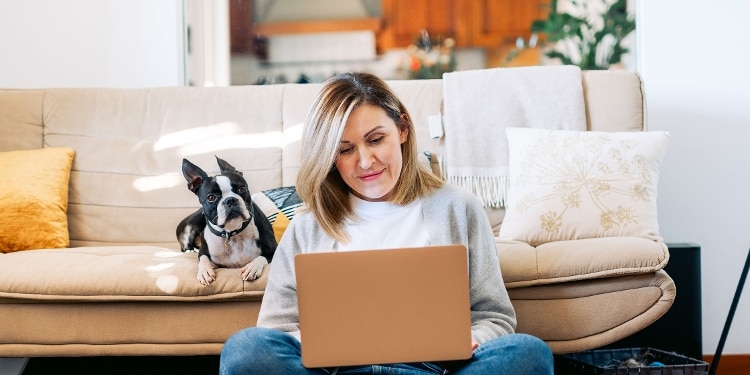 A person checks their Experian credit report on an open laptop.