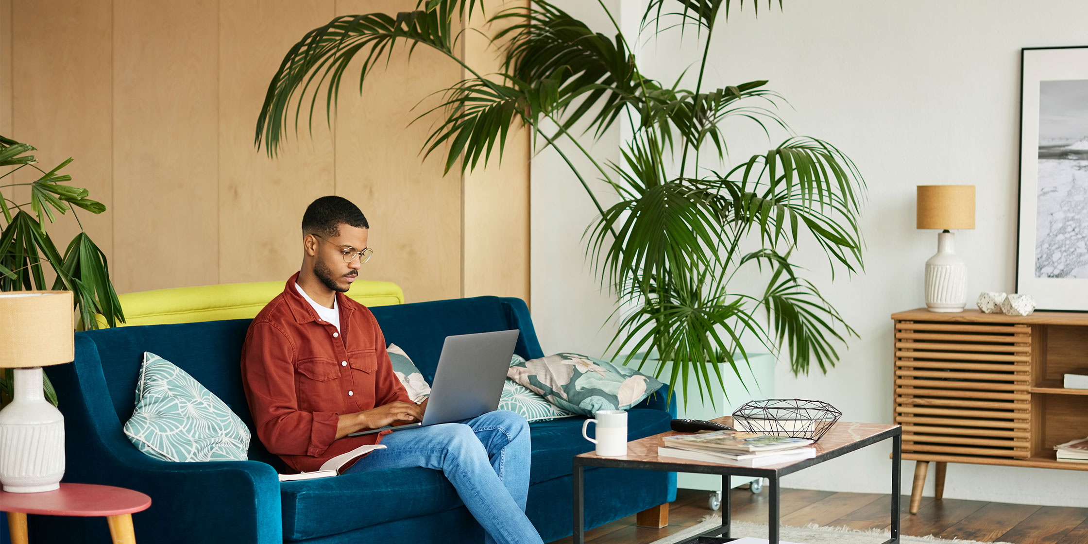 A photo of a person viewing their credit card balance on their laptop.