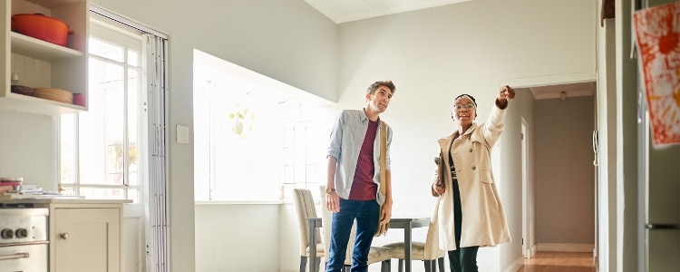 A couple touring a house together.