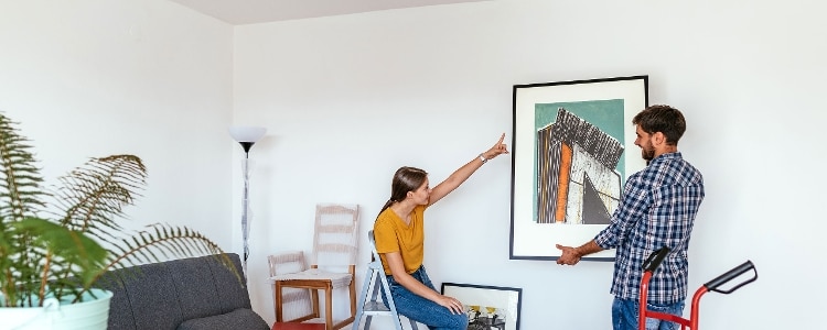 A first-time homebuying couple moves into a home with down payment assistance.