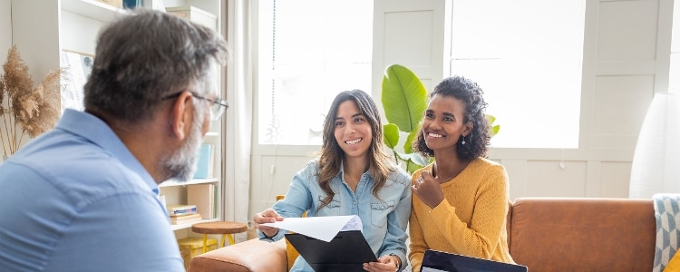 A couple discusses how they might be able to qualify for a first-time homebuyer loan.