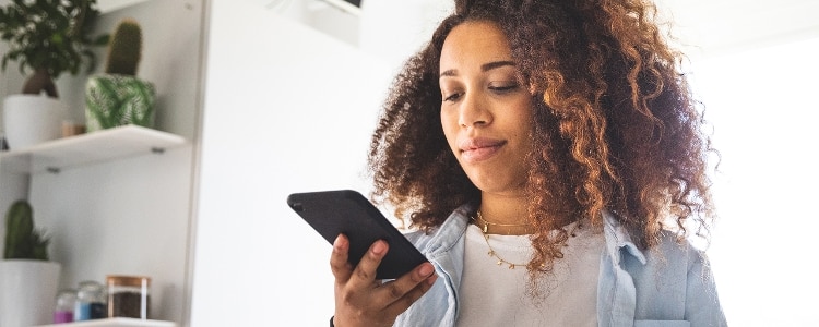 A woman considers ways to be resilient and strengthen her finances during economic uncertainty.