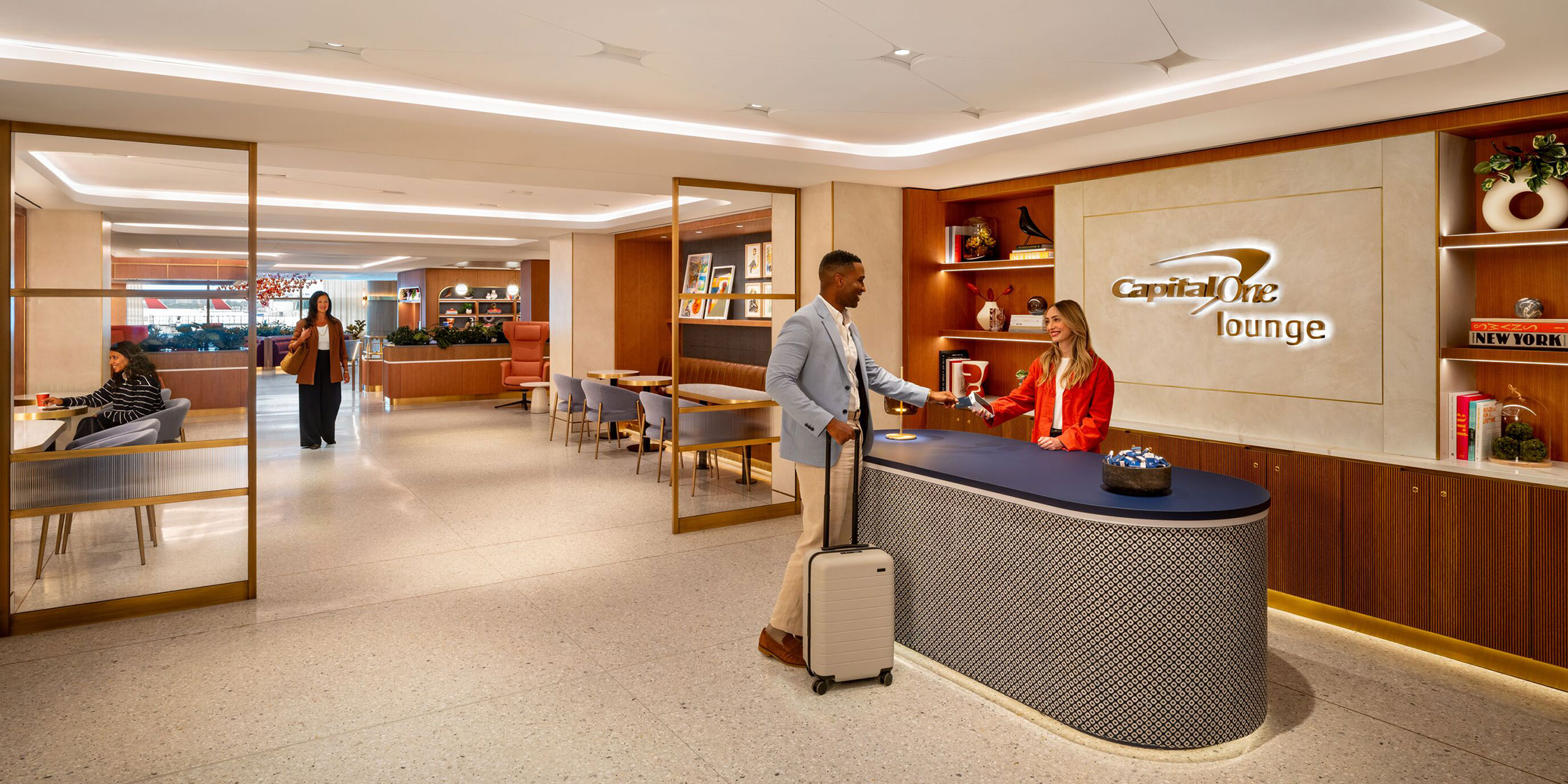 People enjoying the Capital One Lounge at JFK.