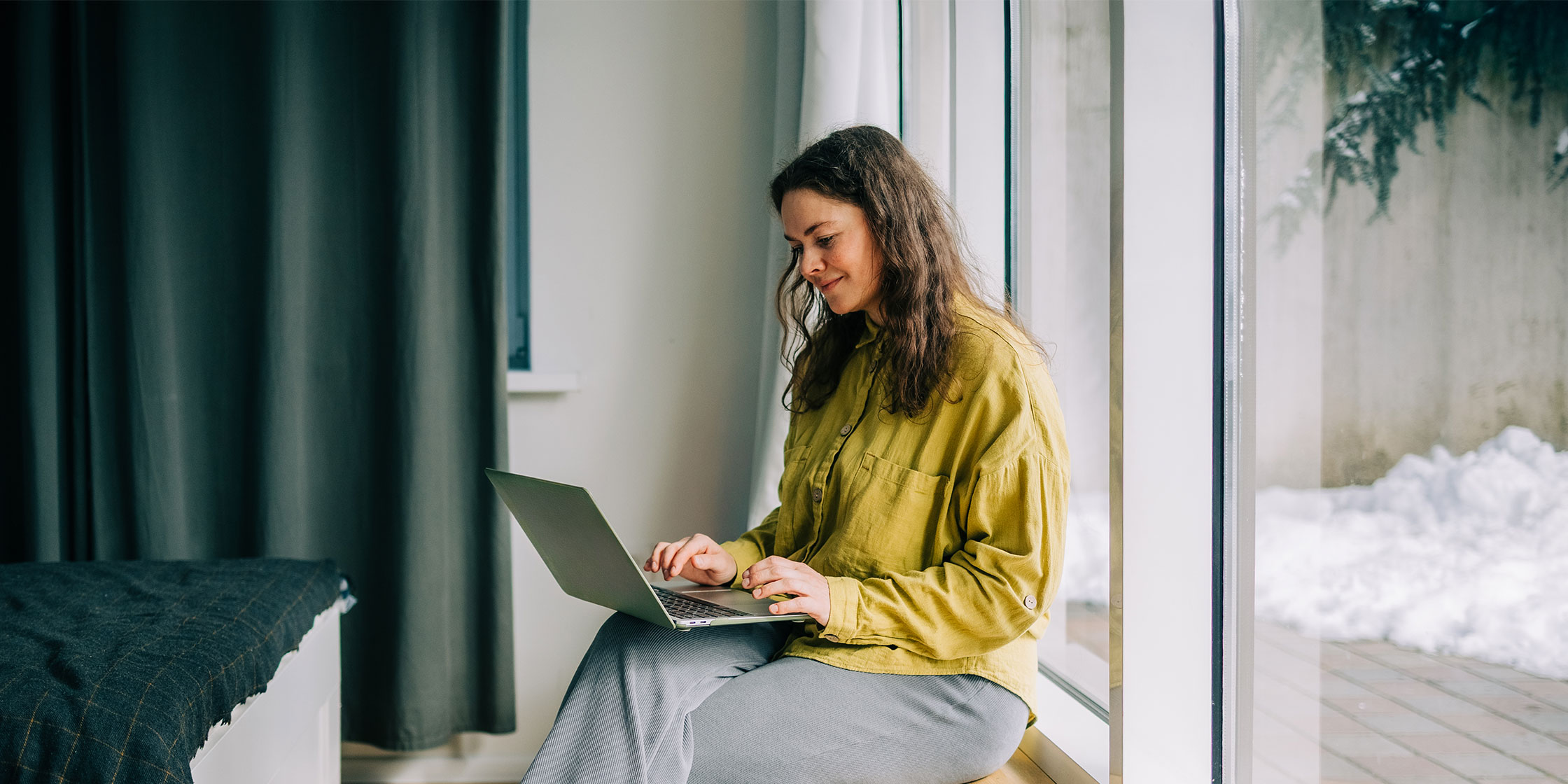 Person uses a laptop to investigate their credit card payment history.