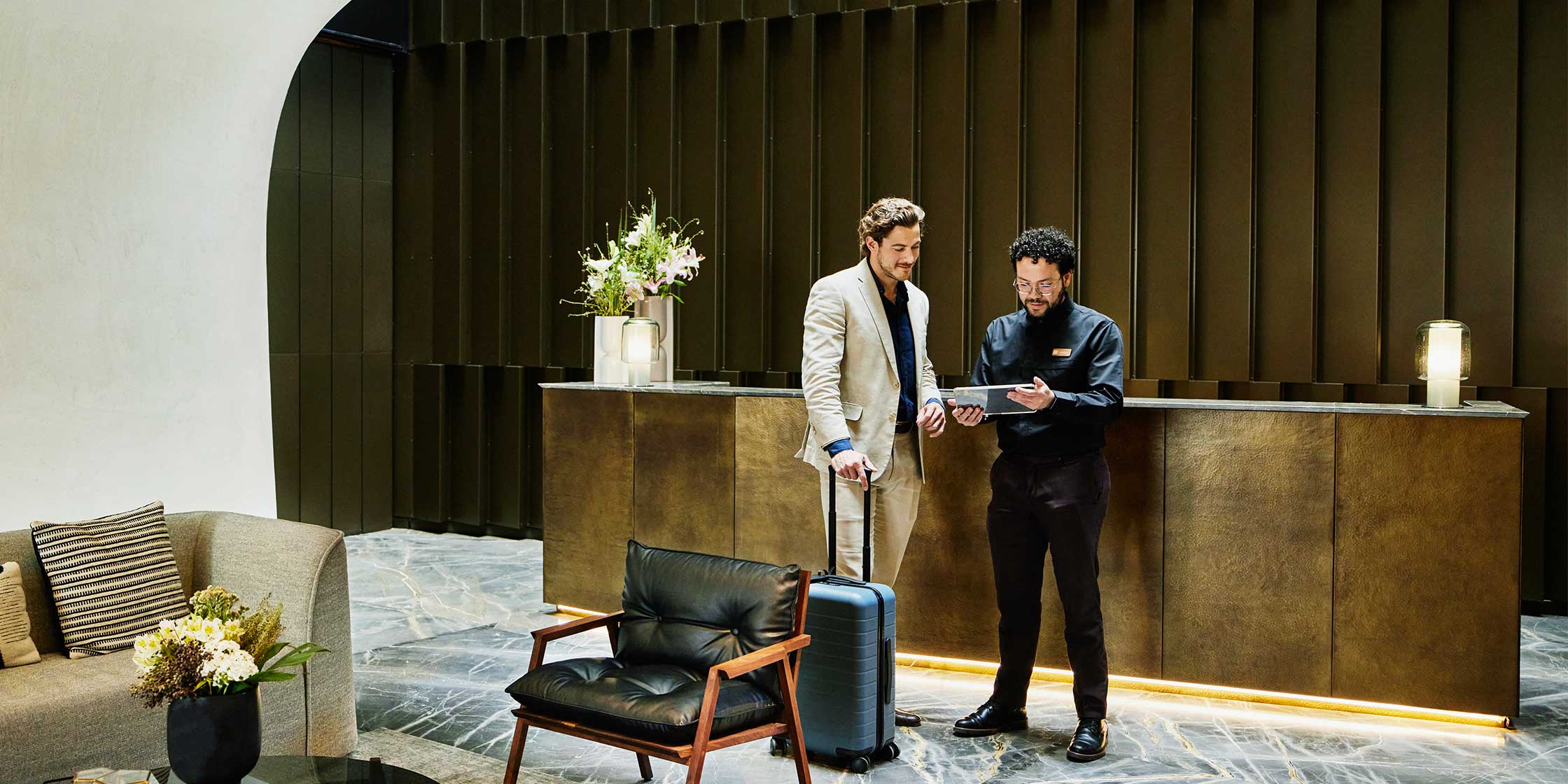 A traveler checks in at a luxury hotel, which he booked using a credit card with no preset spending limit.