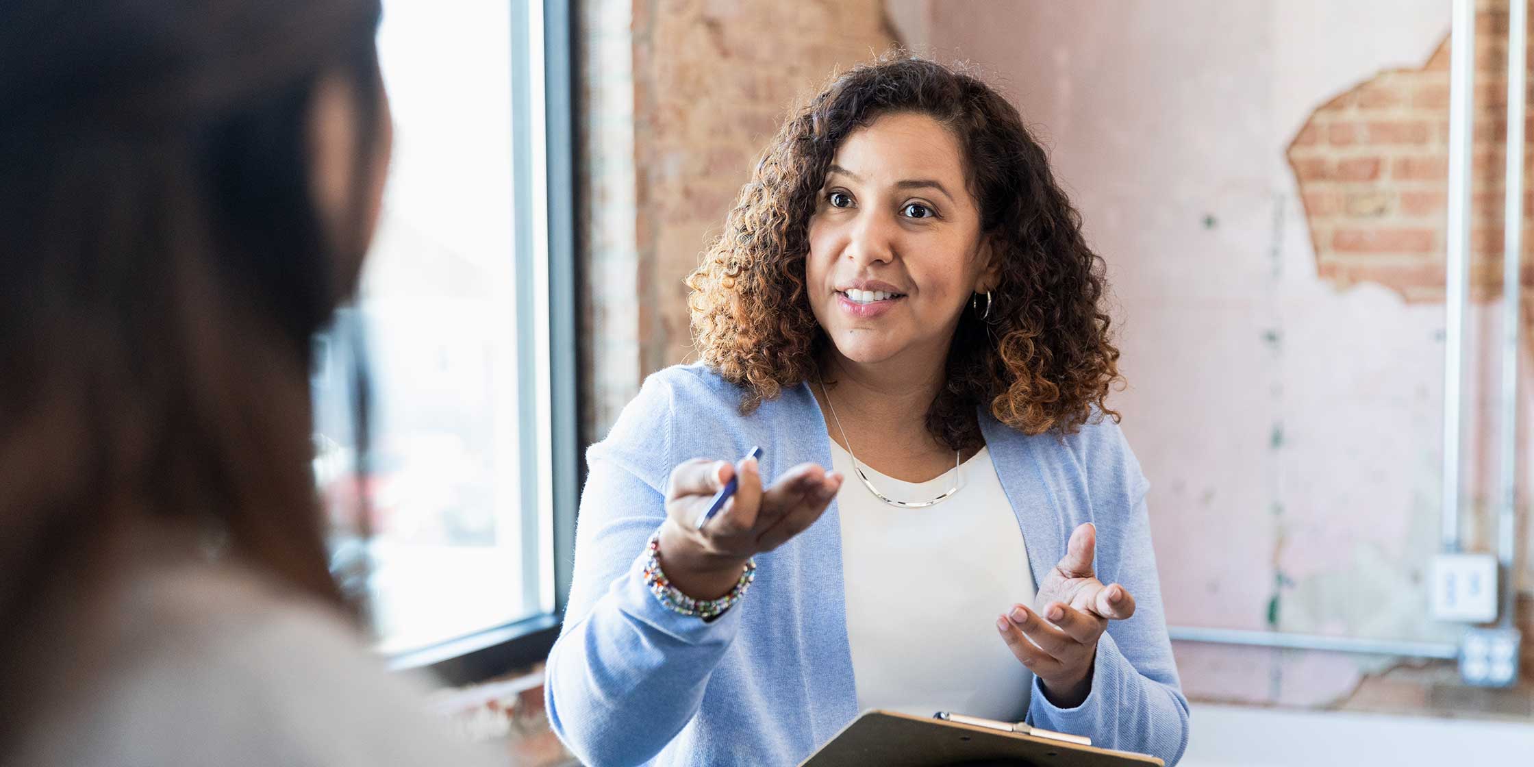 A potential employer asks a job candidate about salary expectations during an interview.