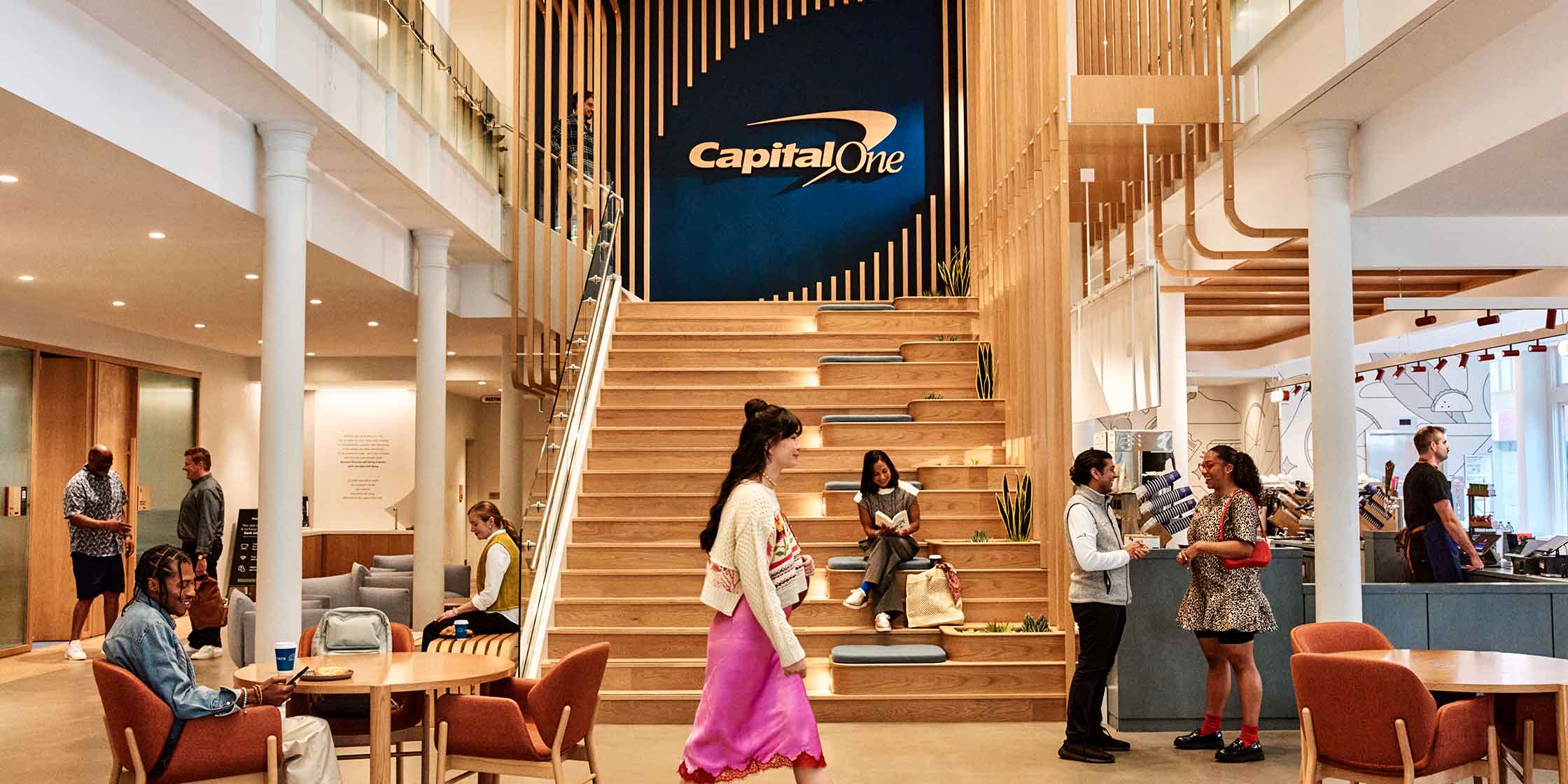Community members relax, recharge and reconnect at their local Capital One Café.