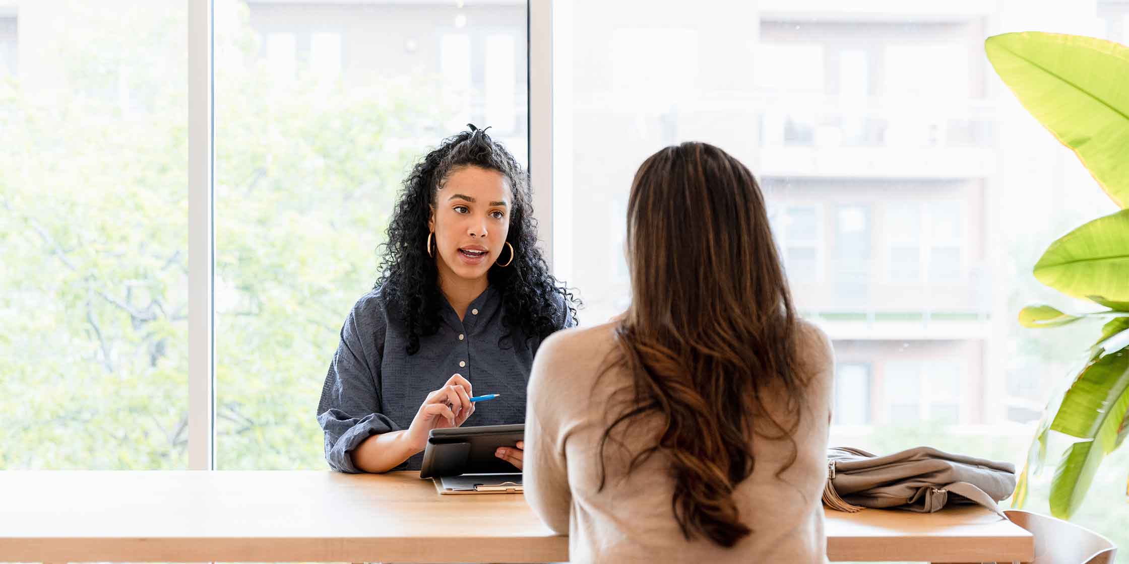 A debtor reviews the terms of their new loan with a creditor.