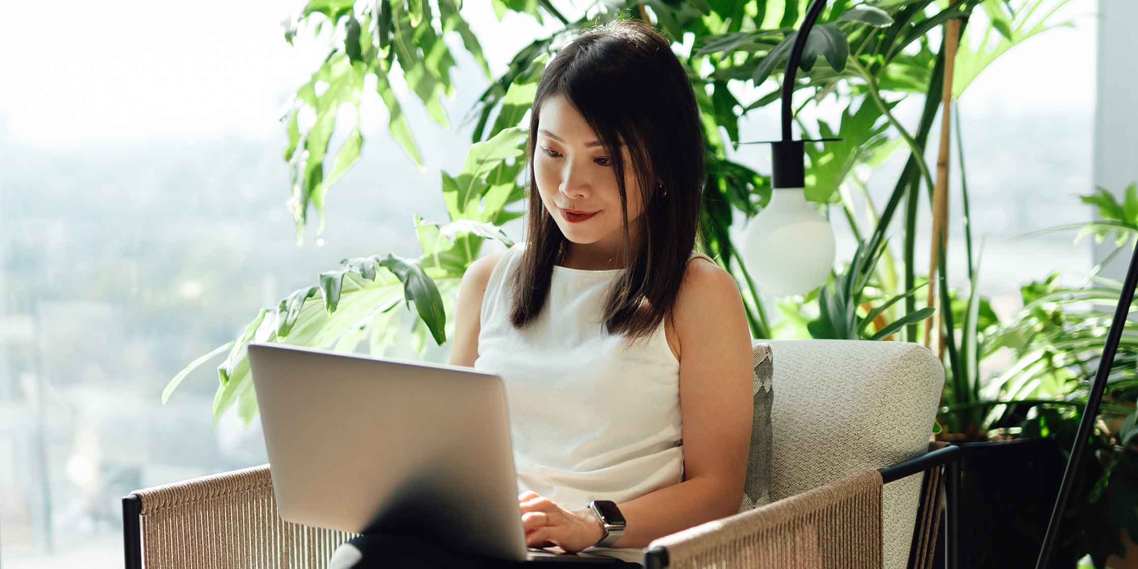 A person looking at their increased loan balance on their laptop.