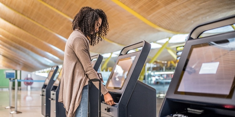 A person uses Global Entry at customs to speed up reentry into the U.S.
