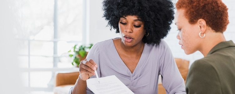 Two people discuss the terms of a loan.