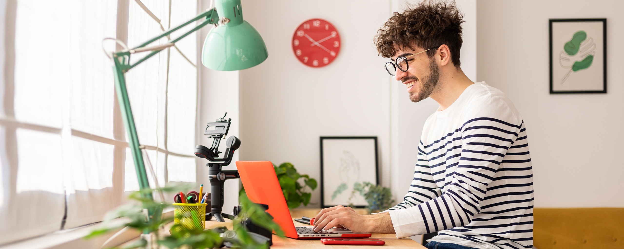 A person looks at their laptop to see they received a bonus.