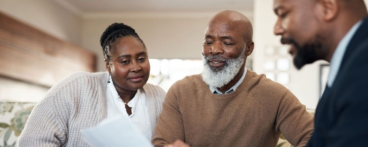 A family looking over a document together.