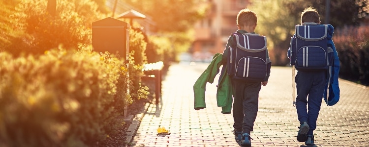 Stylish kids walk to school.