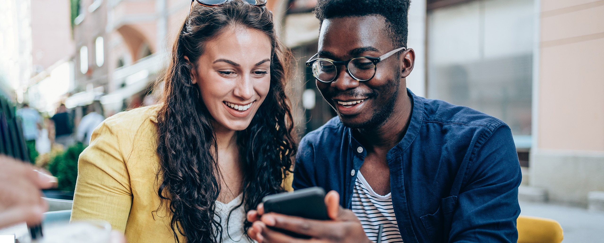Two people on their phone.