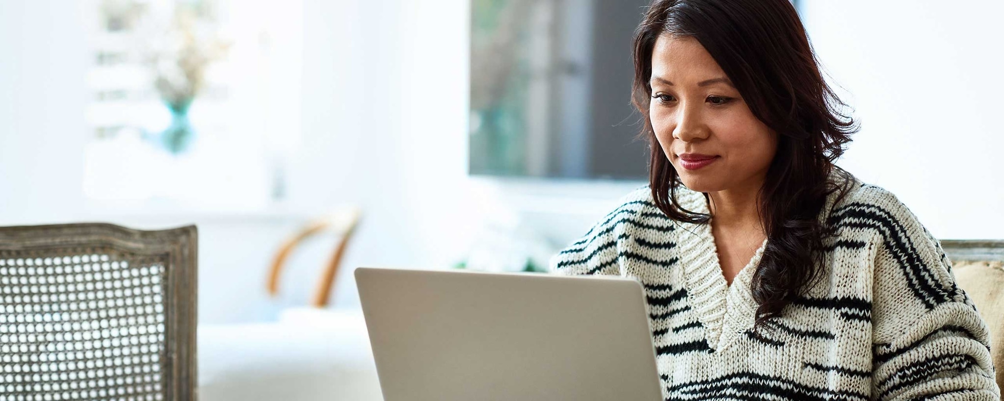 Woman business owner working on her laptop.