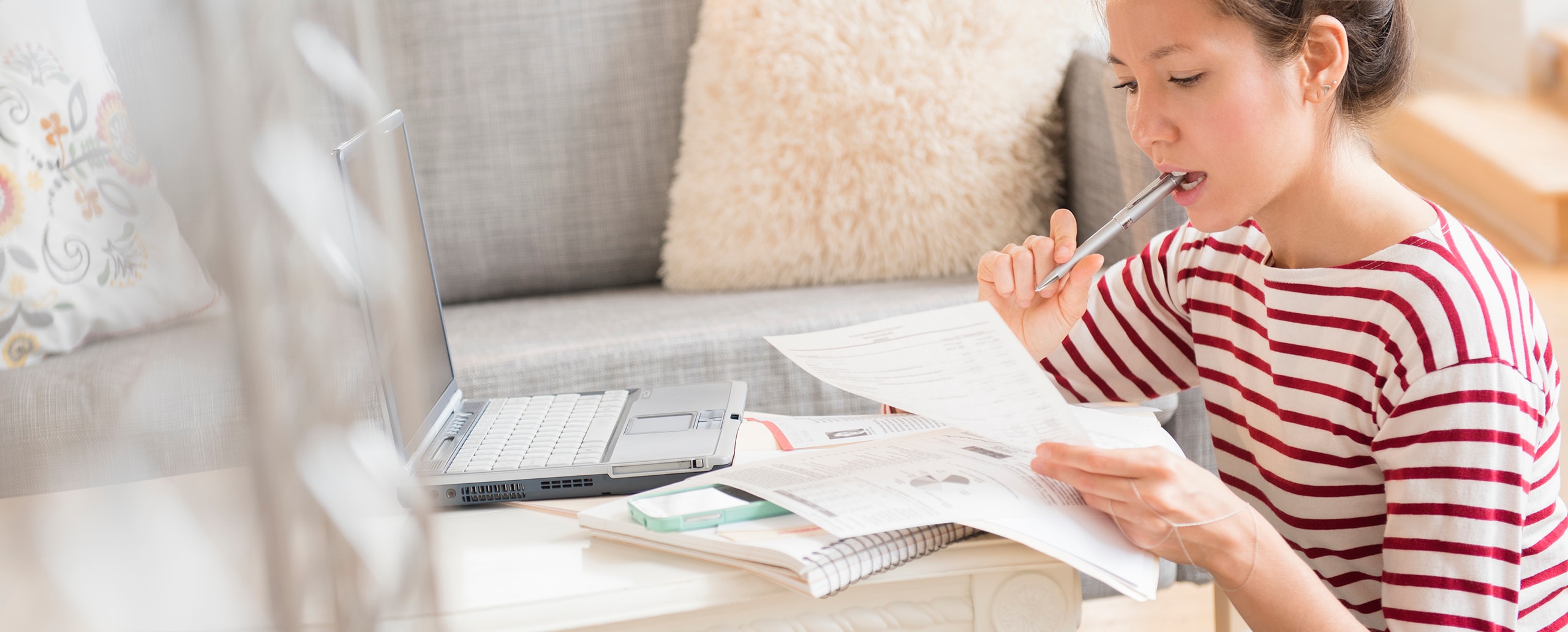 Woman looking at papers.