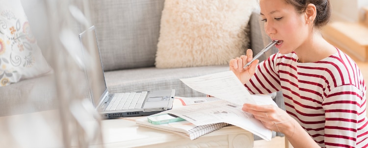 Woman looking at papers.