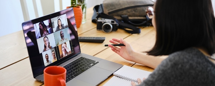 Business leader hosts virtual workshop with employees on business fraud awareness.