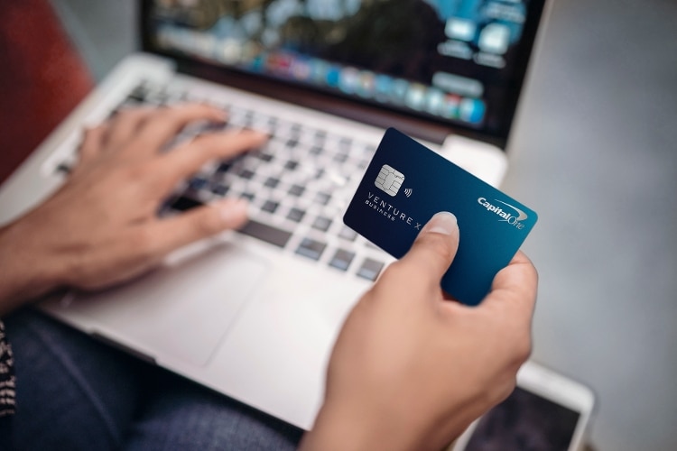 Hand holding Venture X Business credit card