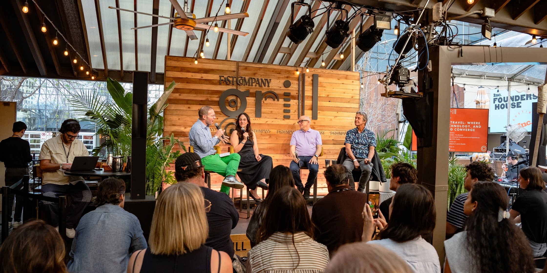 Panel of speakers on a stage