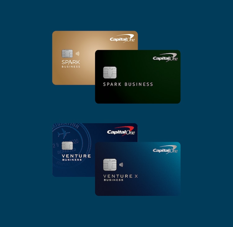 Gold, green and blue Capital One Spark Business cards and blue Capital One Venture X Business card on a dark blue background