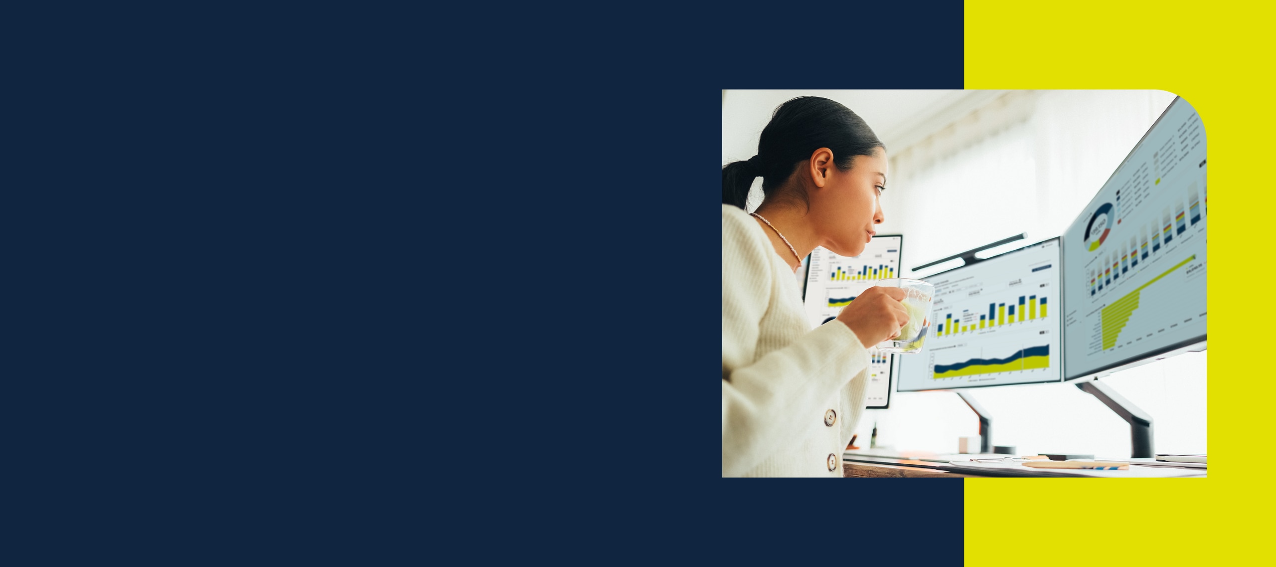 Woman looking at 2 computer monitors