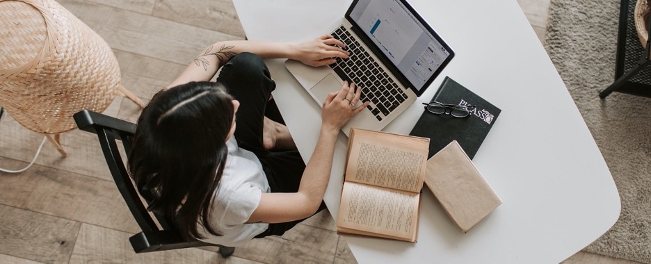overhead shot of female engineer studying at her computer