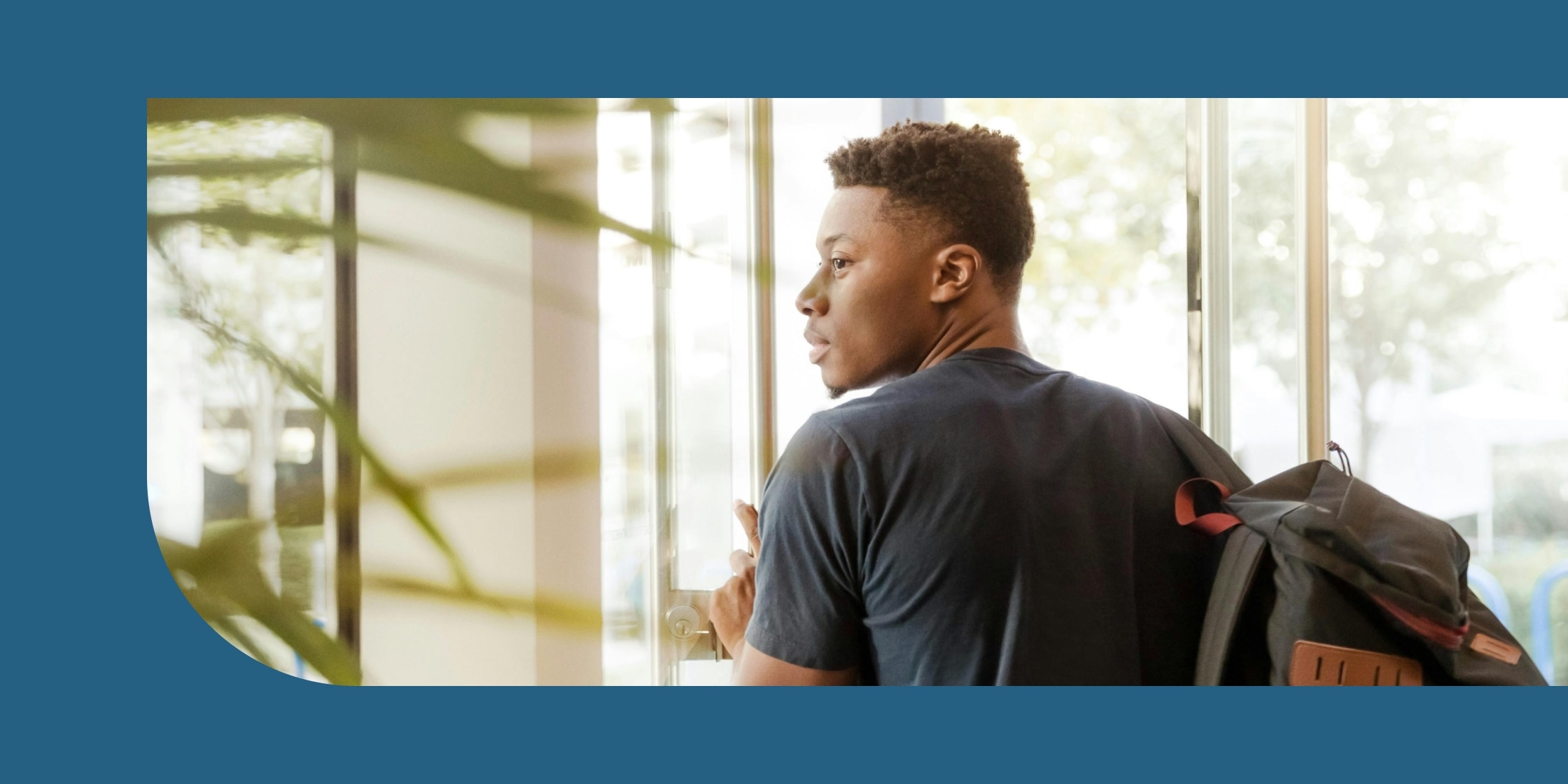 Young man walking out of a door wearing a backpack, highlighting AI innovation and academic partnerships.