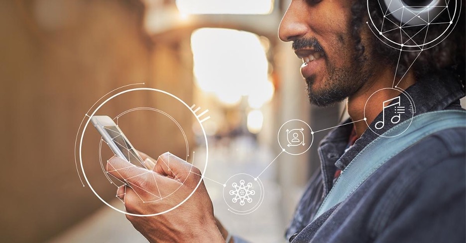 man holding iphone and wearing black headphones with white music vector icons connecting the 2 devices